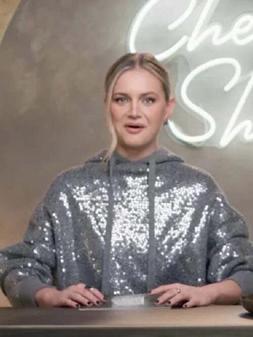 Kelsea Ballerini in a grey sequin hoodie promotes the show Cheap Shots