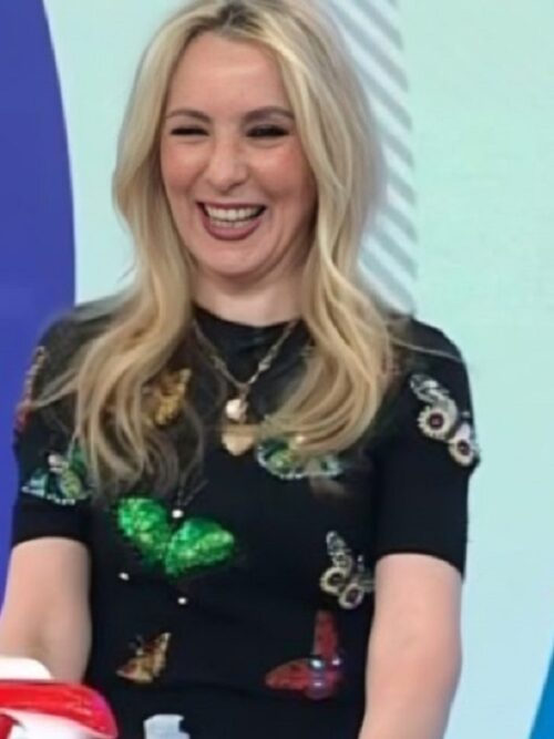 Chassie Post, smiling with long blonde hair, wears the Black Butterfly Sweater during her appearance on The Today Show 2025.