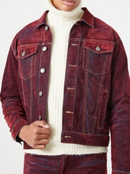 Antonio Ramsey, dressed in a red denim jacket, performs in The Voice Season 27.