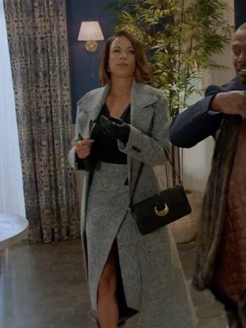 Daphnee Duplaix, in a grey tweed coat and black dress, strides down the street as Dr. Nicole Dupree Richardson from Beyond the Gates.