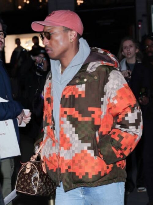 Pharrell Williams makes a statement at Paris Fashion Week in a bold pixelated Pharrell Williams Paris Fashion Week Puffer Jacket, combining street style with high fashion effortlessly.