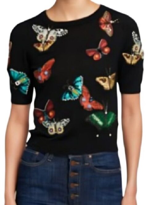 A colorful butterfly printed black sweater styled by the Chassie Post in The Today Show
