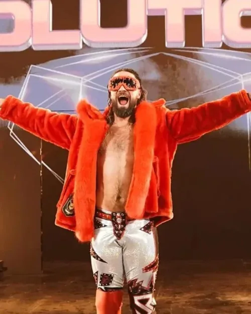 Seth Rollins in a striking red jacket and boots, capturing attention during WWE Monday Night Raw.