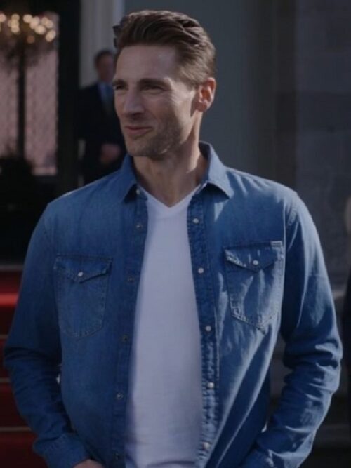 The Reluctant Royal 2025 star Andrew Walker wears a stylish The Reluctant Royal 2025 Andrew Walker Denim Overshirt, adding a classic touch to his look.